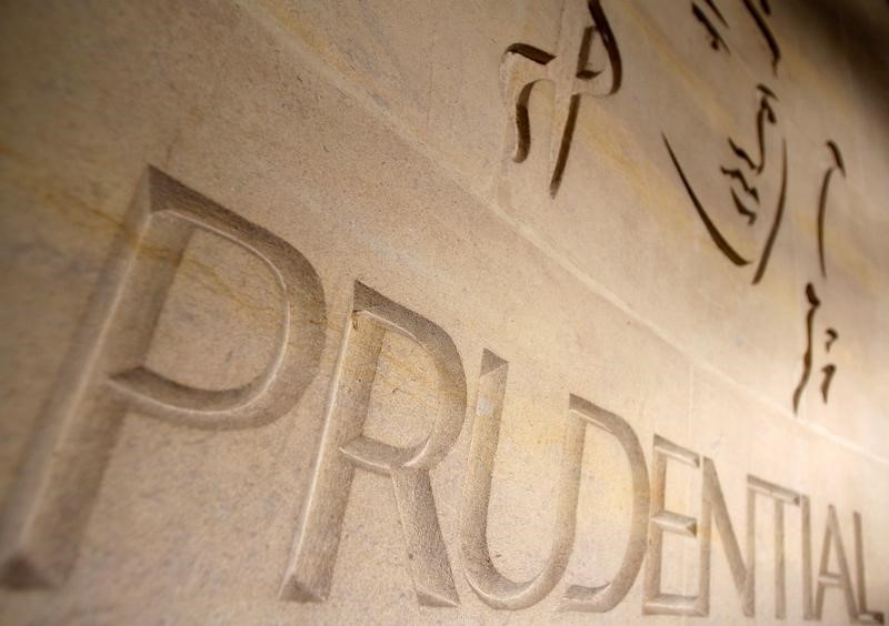 © Reuters. PRUDENTIAL FUSIONNE GESTION D'ACTIFS ET ASSURANCE AU ROYAUME-UNI