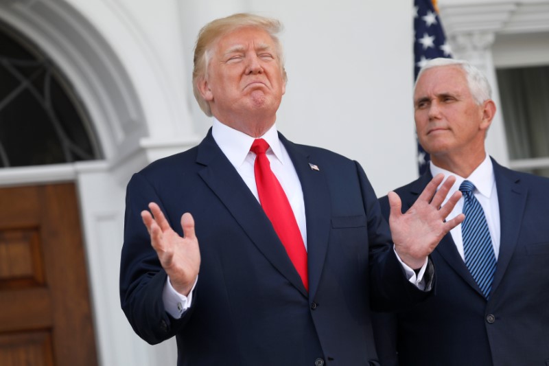 © Reuters. U.S. President Trump speaks to reporters with Vice President Mike Pence at his side in Bedminster, New Jersey