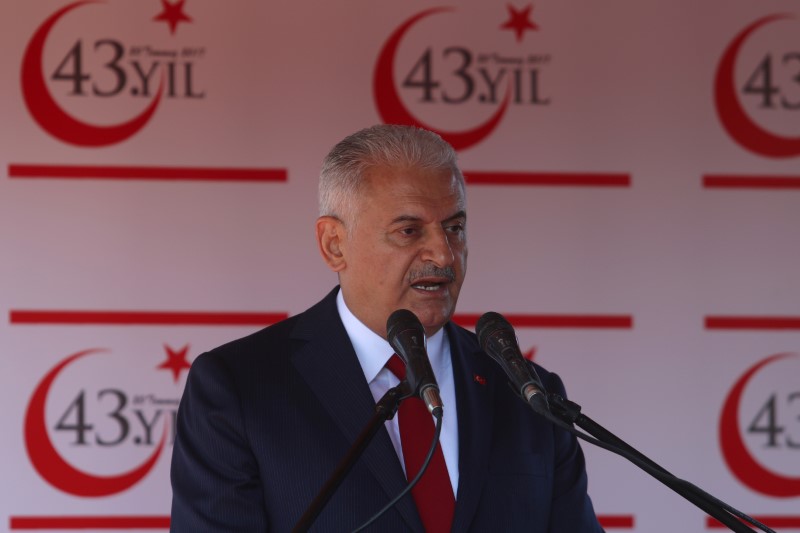 © Reuters. Turkish Prime Minister Binali Yildirim delivers a speech before a parade to mark the 1974 Turkish invasion of Cyprus in response to a briefly lived Greek-inspired coup, in the Turkish-administered northern part of Nicosia