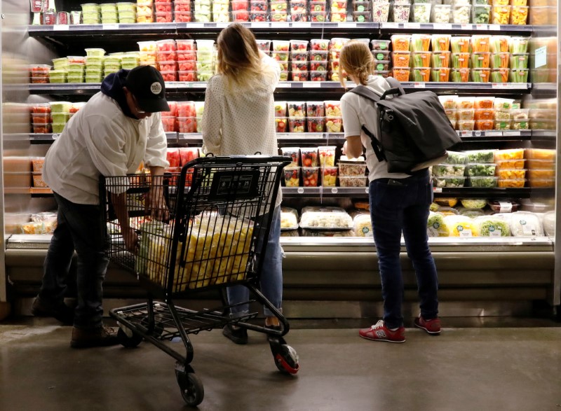 © Reuters. Customers shop at a Whole Foods store in New York