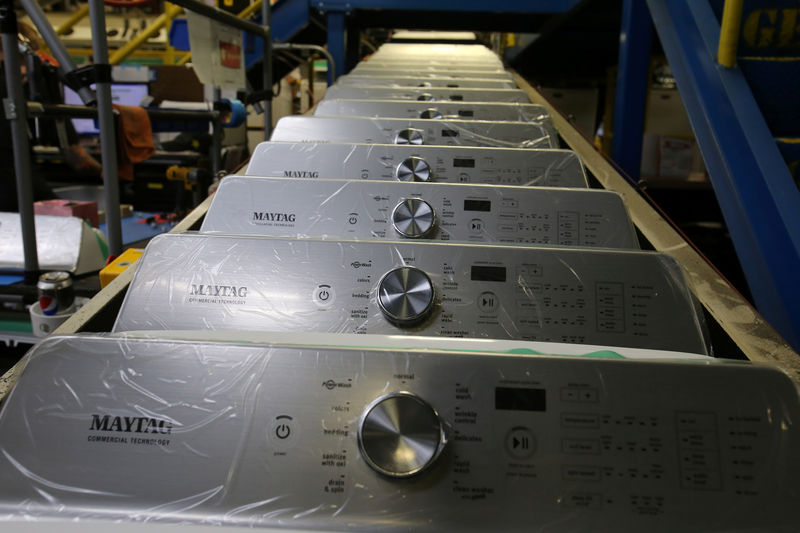 © Reuters. Washing machine parts move along a conveyor belt waiting to be assembled  at a Whirlpool plant in Clyde