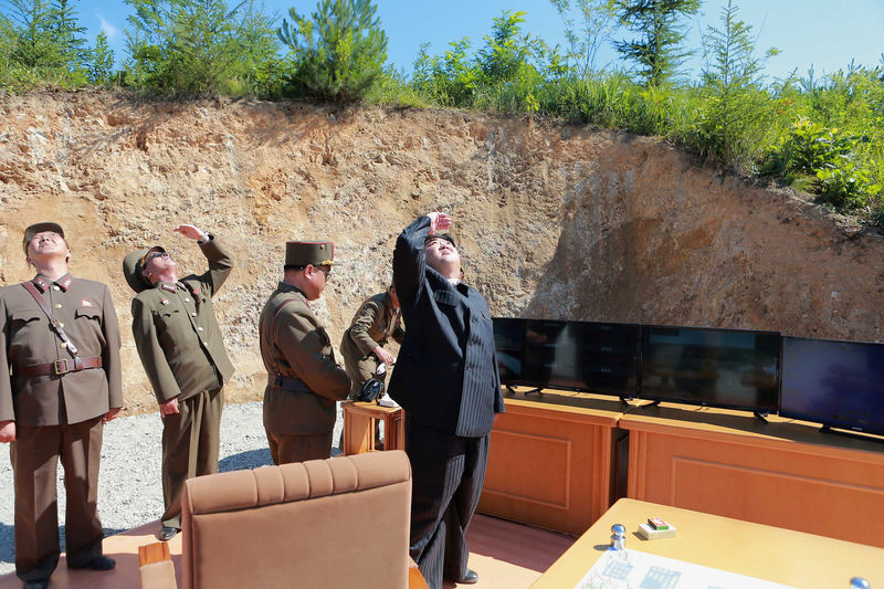 © Reuters. North Korean leader Kim Jong Un looks on during the test-launch of the intercontinental ballistic missile Hwasong-14 in this undated photo released by North Korea's KCNA in Pyongyang