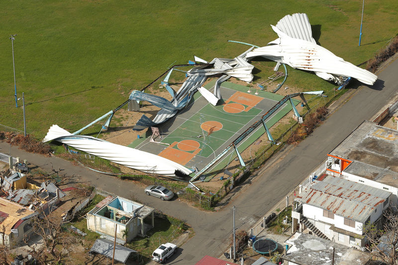 © Reuters. Remains of a shed is scattered over a basketball court after Hurricane Maria near Loiza, Puerto Rico