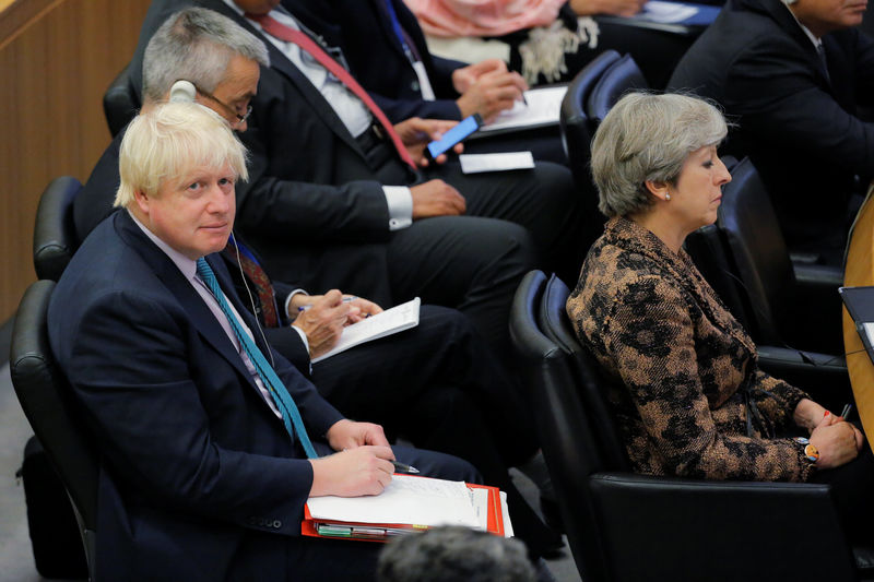 © Reuters. British Prime Minister Theresa May sits in front of British Foreign Secretary Boris Johnson during a meeting to discuss the current situation in Libya during the 72nd United Nations General Assembly at U.N. headquarters in New York