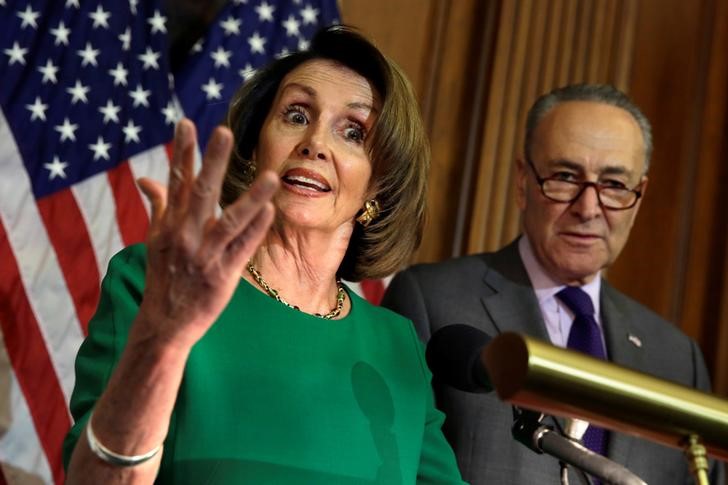 © Reuters. House Minority Leader Nancy Pelosi (D-CA) speaks next to Senate Minority Leader Chuck Schumer (D-NY)