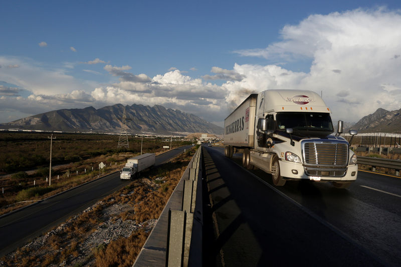 © Reuters. Cargo trucks are pictured at a highway on the outskirts of Monterrey