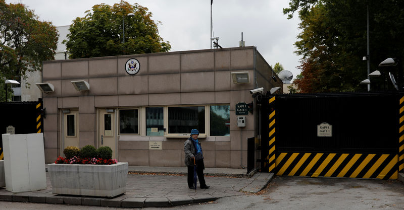 © Reuters. A woman walks past the U.S. Embassy in Ankara