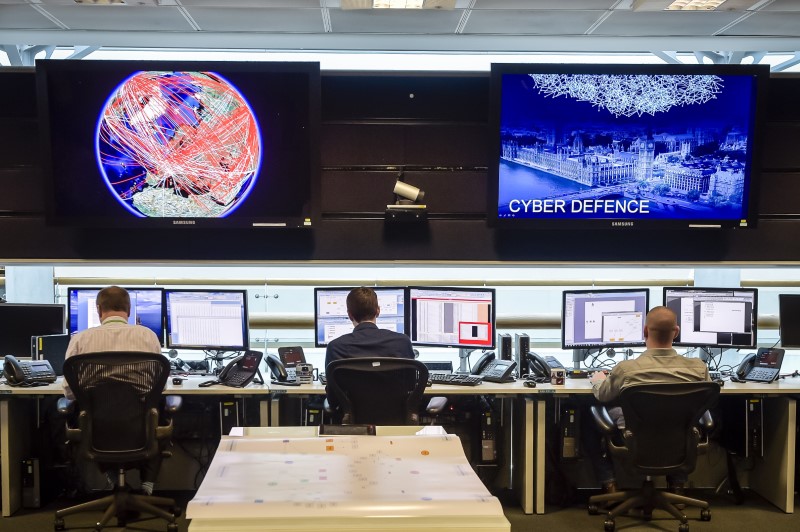 © Reuters. FILE PHOTO - People sit at computers in the 24 hour Operations Room inside GCHQ, Cheltenham in Cheltenham