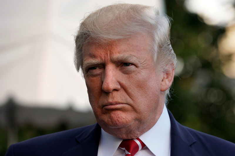 © Reuters. FILE PHOTO: President Donald Trump talks to the media