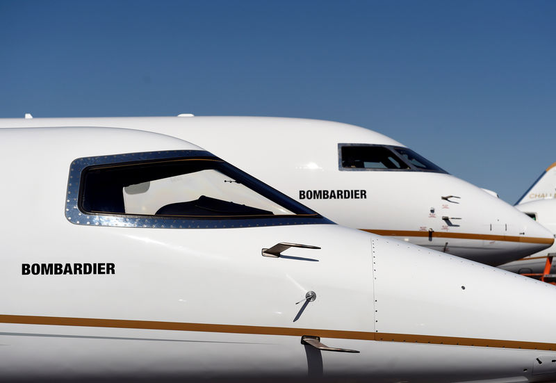 © Reuters. Bombardier's new Global 7000 business jet is seen parked next to a Learjet 75 during the National Business Aviation Association at the Henderson Executive Airport in Henderson