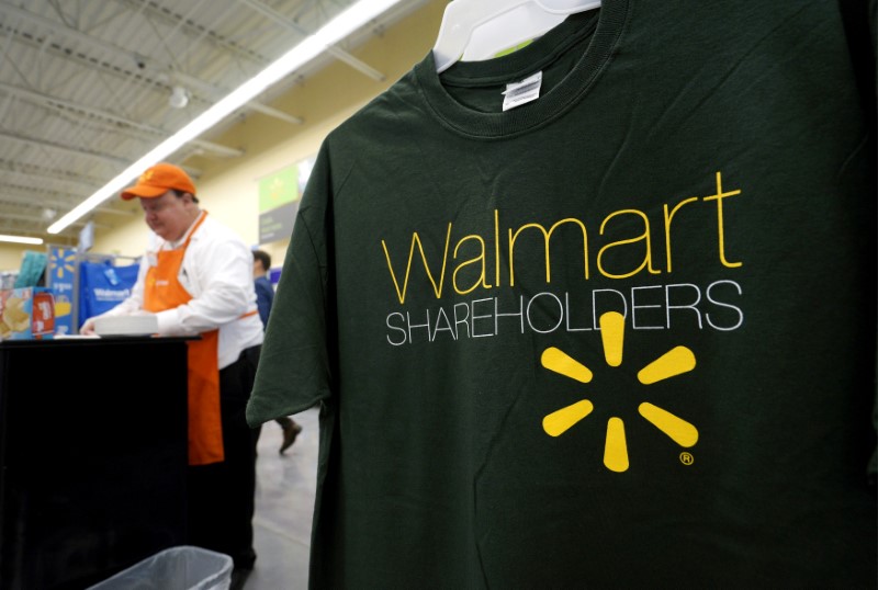 © Reuters. FILE PHOTO - Souvenir t-shirts for sale at the Wal-Mart Neighborhood Market in Bentonville