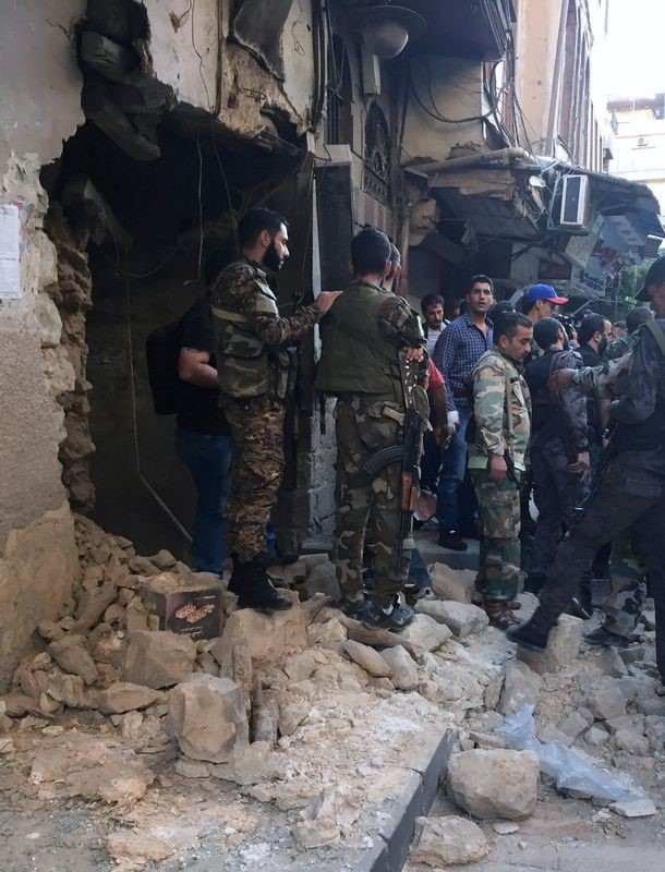 © Reuters. وسائل إعلام سورية: انتحاريون يهاجمون مقر الشرطة بوسط دمشق