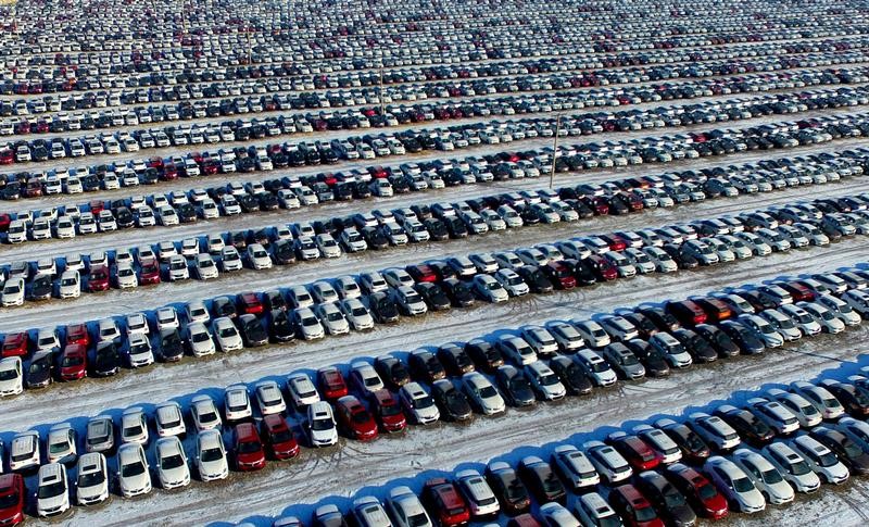 © Reuters. New cars are seen at a parking lot in Shenyang