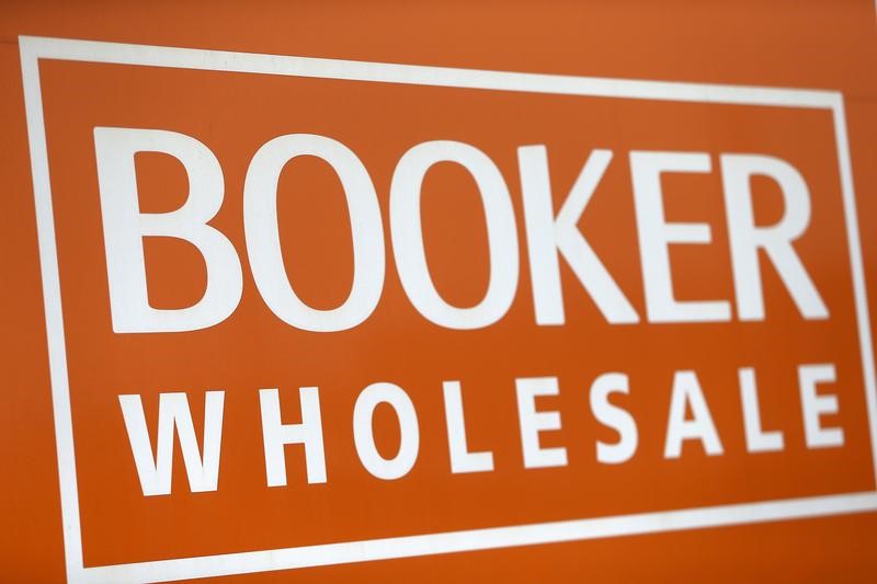 © Reuters. FILE PHOTO: A branded sign is displayed outside of a Booker Wholesale store in London