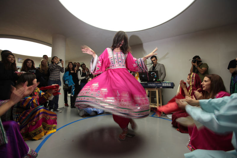 © Reuters. Refugees from Afghanistan dance during an event aimed to bridge cultural differences in Sofia