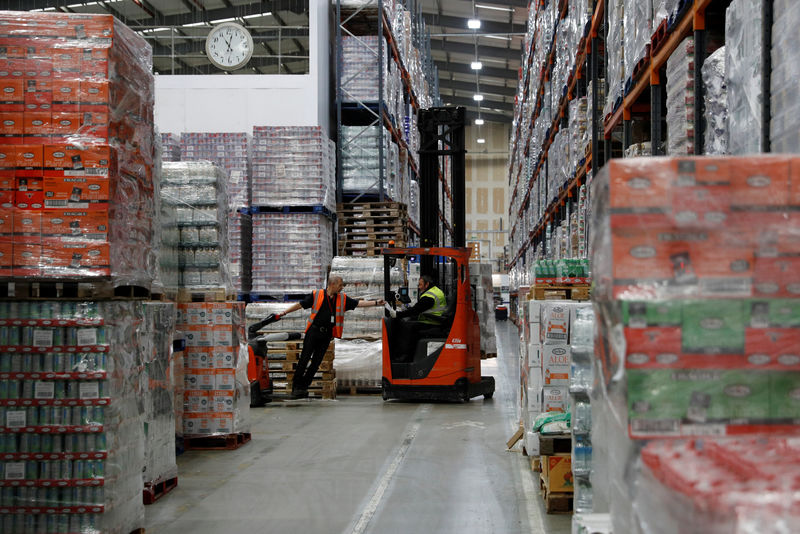 © Reuters. Men work at Grace Foods UK distribution centre in Welwyn Garden City