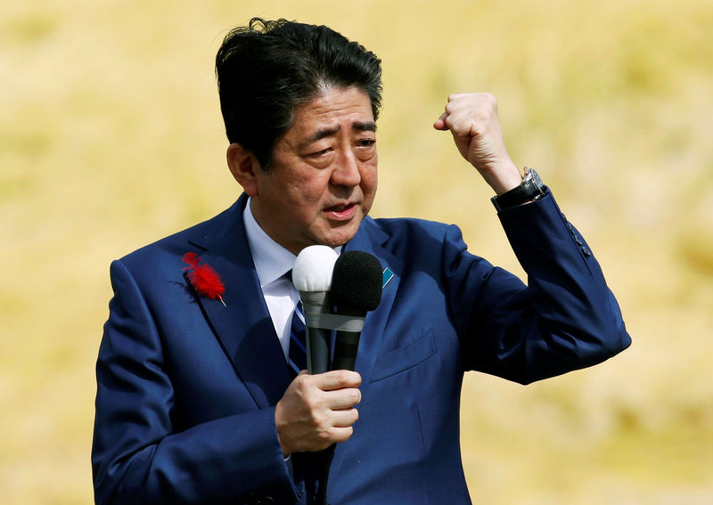 © Reuters. Japan's Prime Minister Shinzo Abe, who is also ruling Liberal Democratic Party leader, attends an election campaign rally in Fukushima