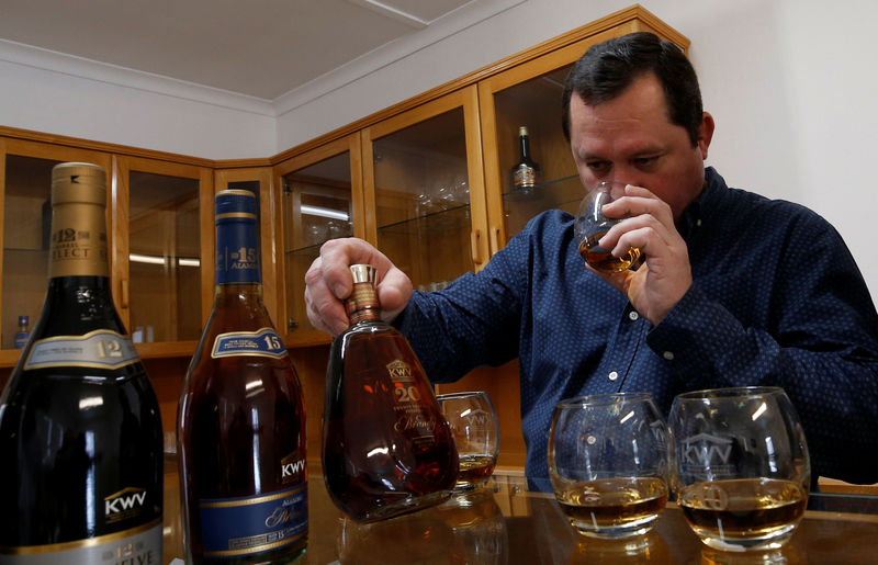 © Reuters. Brandy master Pieter de Bod samples some of his company's produce during a tasting at the KWV distillery in Paarl near Cape Town