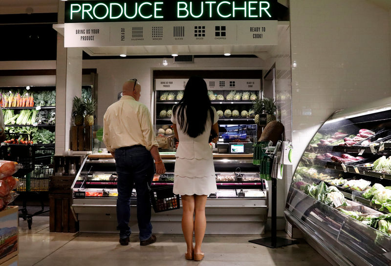 © Reuters. FILE PHOTO: Customers shop at a Whole Foods store in New York