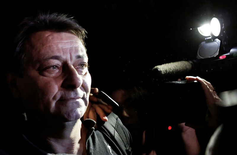 © Reuters. FILE PHOTO: Italian former leftist guerrilla Cesare Battisti leaves the headquarters of the Federal Police in Sao Paulo