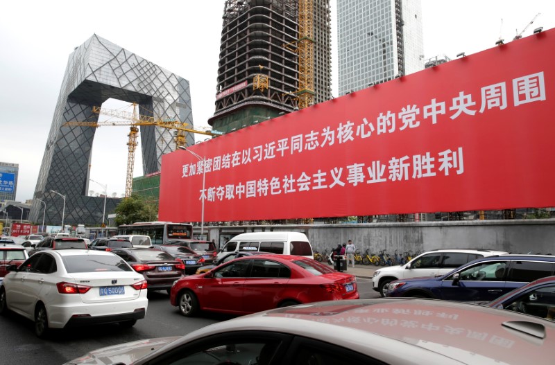 © Reuters. A giant banner is seen in Beijing's central business area as the capital prepares for the 19th National Congress of the Communist Party of China