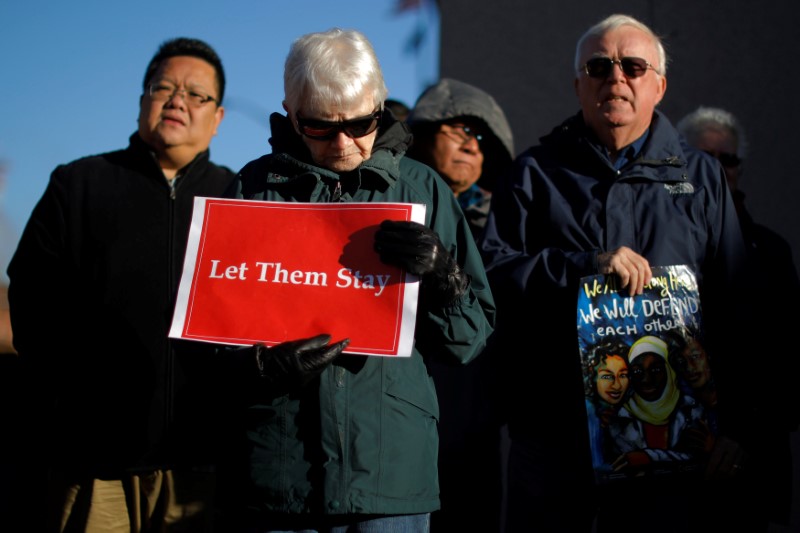 © Reuters. Demonstrators hold an