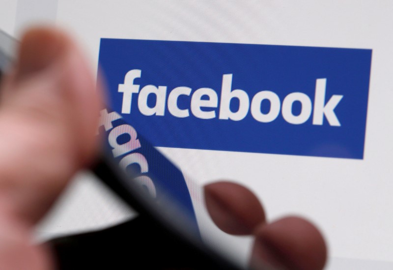 © Reuters. FILE PHOTO - The Facebook logo is displayed on their website in an illustration photo