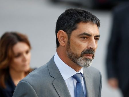 © Reuters. Josep Lluis Trapero, the head of the Mossos d'Esquadra, the Catalan regional police force, enters the High Court to testify for the alleged crime of sedition in Madrid