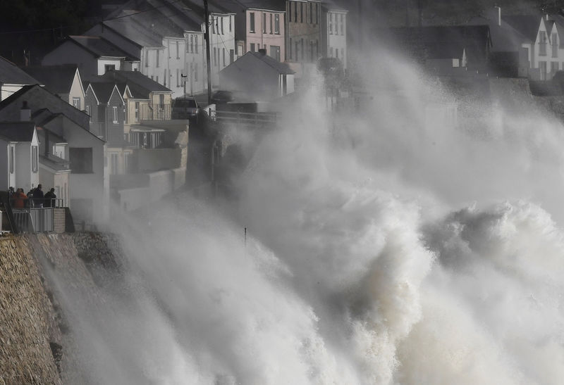 © Reuters. Large waves crash along sea defences and the harbour as storm Ophelia approaches Porthleven in Cornwall, south west Britain