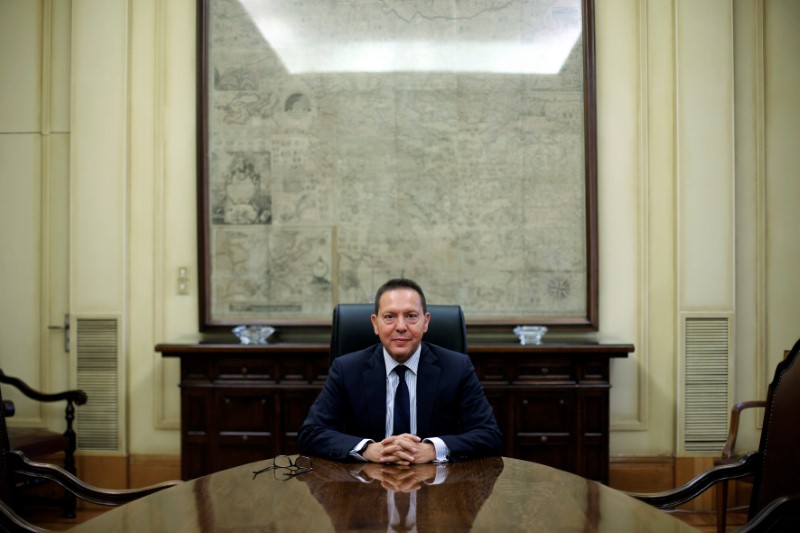 © Reuters. Governor of the Central Bank of Greece Stournaras poses for a picture during an interview with Reuters at the bank's headquarters in Athens