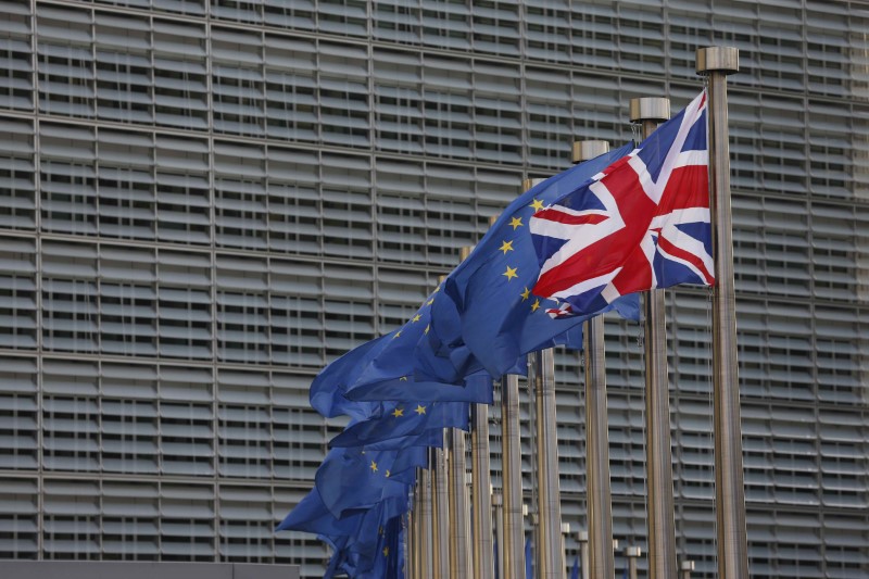 © Reuters. A Union Jack flag flutters next to European Union flags ahead of a visit of Britain's Prime Minister Theresa May and Britain's Secretary of State for Exiting the European Union David Davis at the European Commission headquarters in Brussels