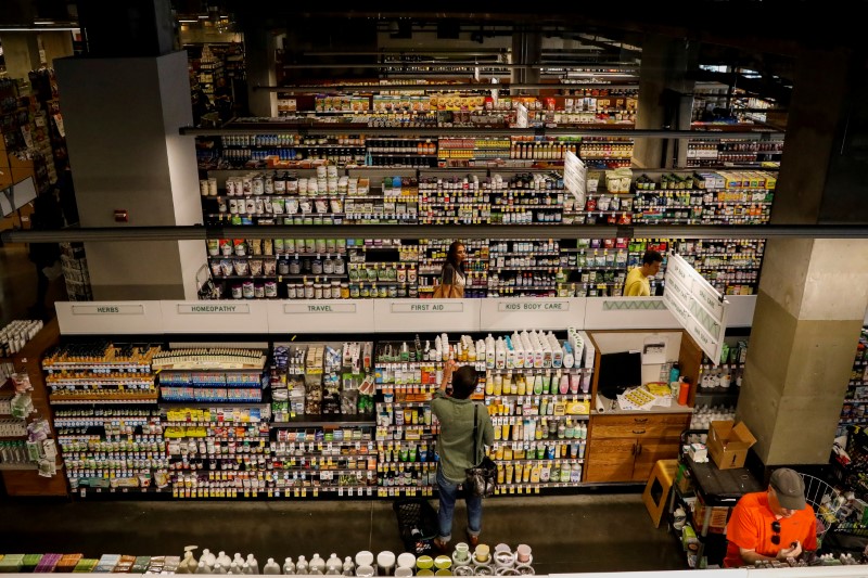 © Reuters. FILE PHOTO: Customers shop at a Whole Foods store in New York
