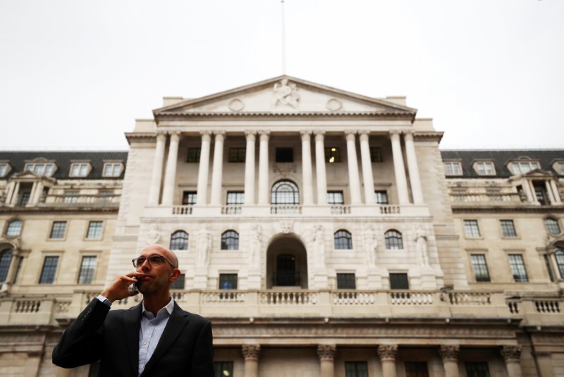 © Reuters. A man speaks on his mobile phone outside the Bank of England in London