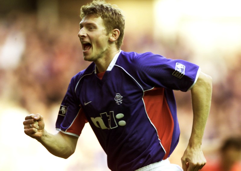 © Reuters. RANGERS' STRIKER TORE ANDRE FLO CELEBRATES AFTER SCORING AGAINST
ABERDEEN.