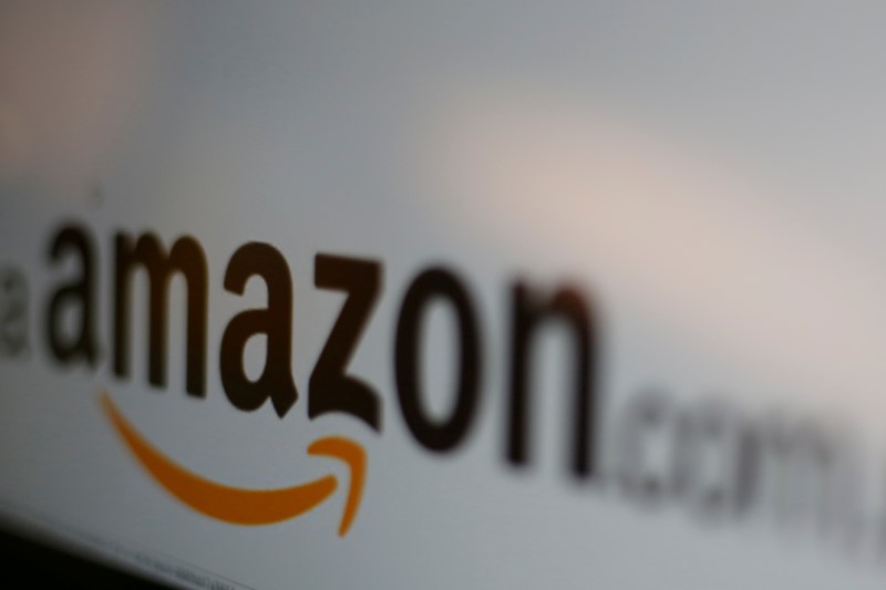 © Reuters. FILE PHOTO: The logo of Amazon is seen at the company logistics center in Lauwin-Planque northern France