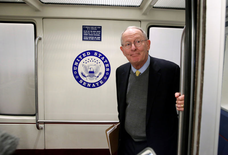 © Reuters. Senate Health, Education, Labor and Pensions Committee Chairman Lamar Alexander (R-TN) stands in the subway on Capitol Hill in Washington