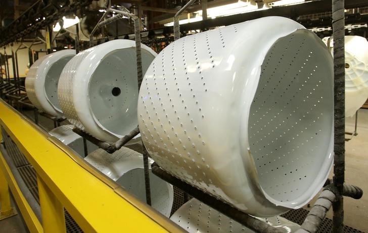 © Reuters. FILE PHOTO: Washing machine baskets sit waiting to be assembled at a Whirlpool plant in Clyde