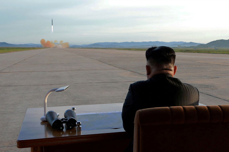 © Reuters. FILE PHOTO: North Korean leader Kim Jong Un watches the launch of a Hwasong-12 missile in this undated photo released by North Korea's KCNA