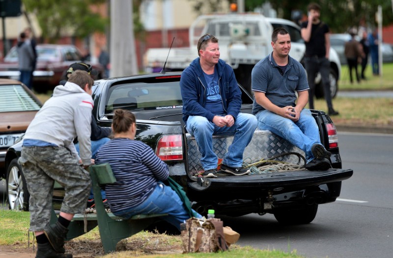 © Reuters. Former Holden employees sit on the back of their Holden ute outside the Holden plant in Elizabeth, South Australia