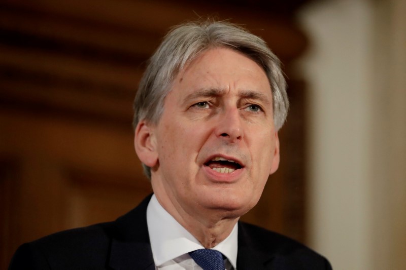 © Reuters. Britain's Chancellor of the Exchequer Philip Hammond attends a joint press conference with the Secretary-General of the Organisation for Economic Co-operation and Development (OECD) Jose Angel Gurria at the Treasury in London