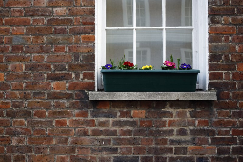 © Reuters. Flowers are seen outside a house in central London