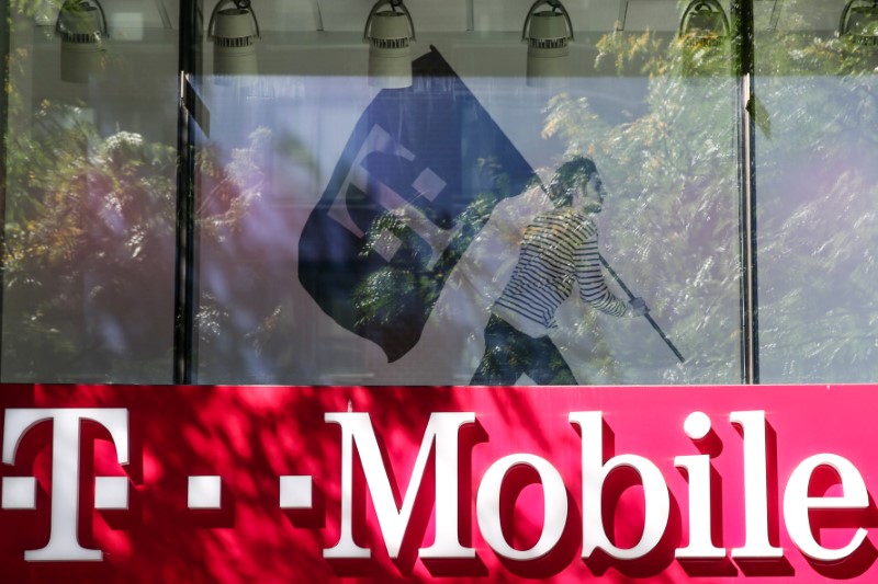 © Reuters. FILE PHOTO: A T-Mobile sign on top of a T-Mobile retail store  in New York.