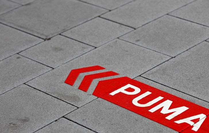 © Reuters. Puma's sign is seen on the street before the company's annual news conference in Herzogenaurach