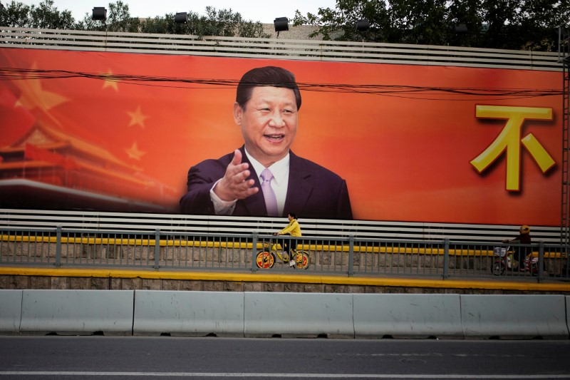 © Reuters. A poster with a portrait of Chinese President Xi is displayed along a street in Shanghai