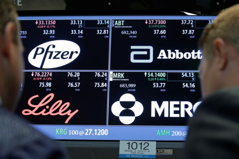 © Reuters. A screen displays trading information for Pfizer, Abbott Laboratories, Merck and Eli Lilly and Company on the floorof the NYSE