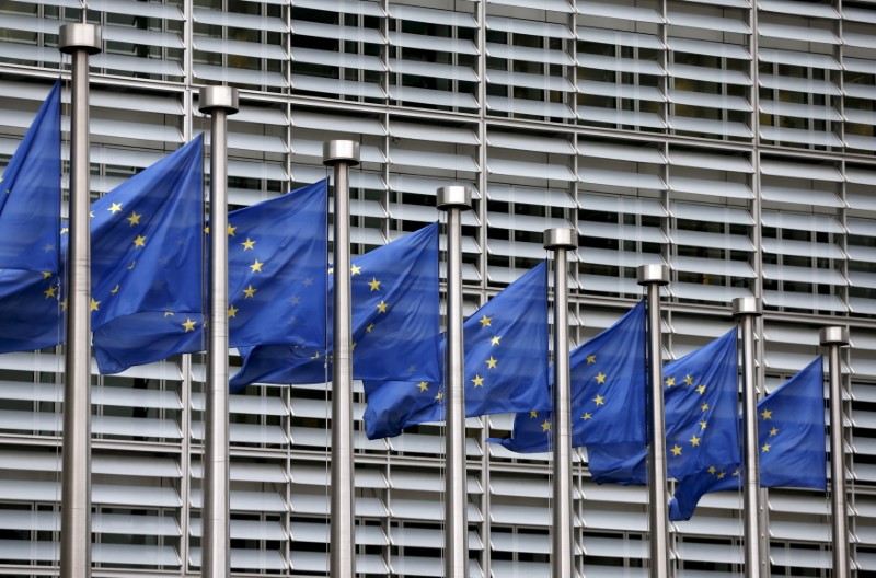 © Reuters. File picture shows European Union flags fluttering outside the EU Commission headquarters in Brussels