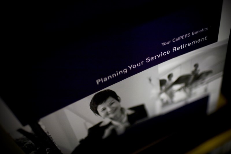 © Reuters. Retirement plan brochures are seen in a rack at the Calpers regional office in Sacramento.