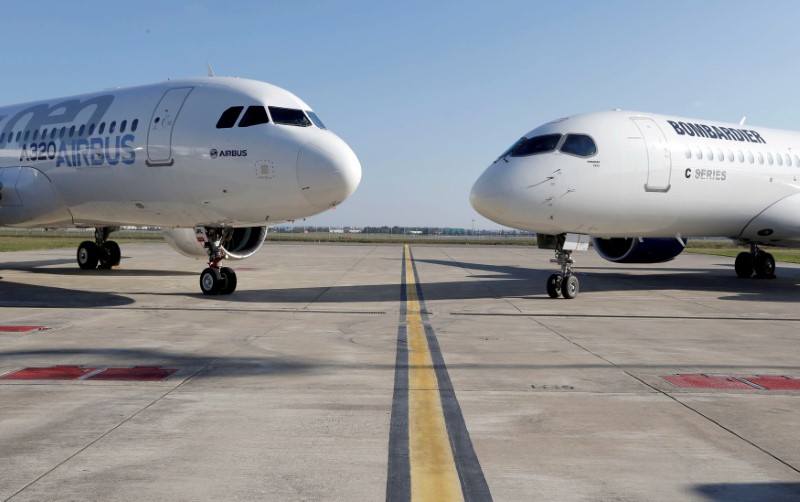 © Reuters. FILE PHOTO: An Airbus A320neo aircraft and a Bombardier CSeries aircraft are pictured during a news conference to announce a partnership between Airbus and Bombardier on the C Series aircraft programme, in Colomiers