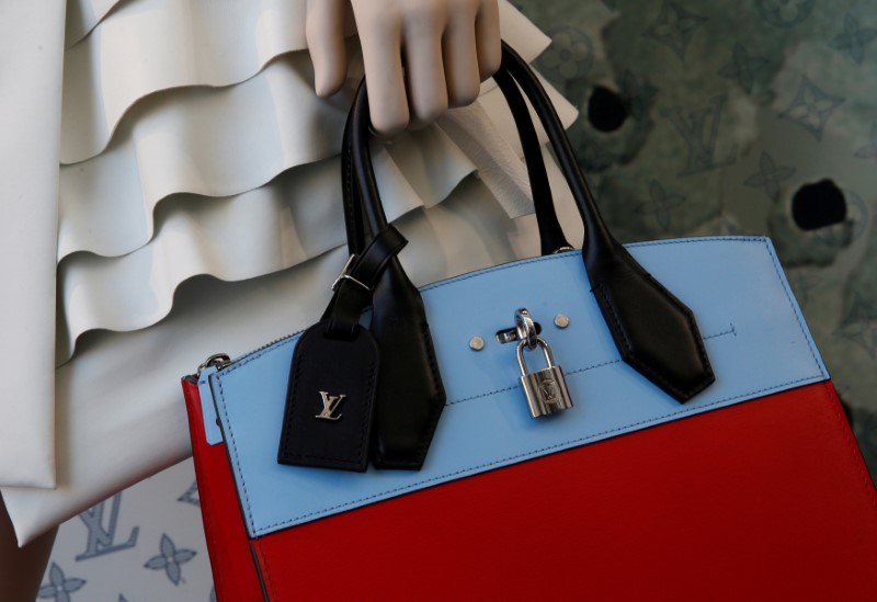 © Reuters. FILE PHOTO: A Louis Vuitton handbag is modelled at a store in Paris