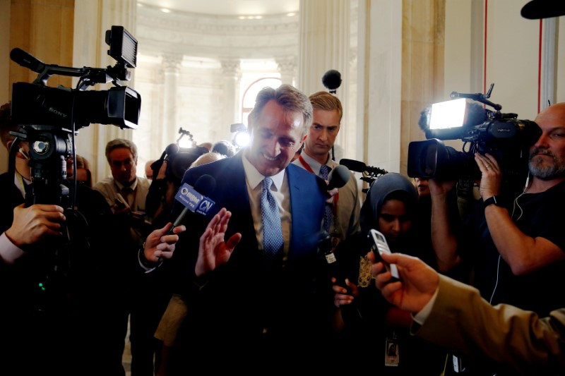 © Reuters. Senator Jeff Flake (R-AZ) speaks to reporters after announcing he will not run for re-election, on Capitol Hill in Washington